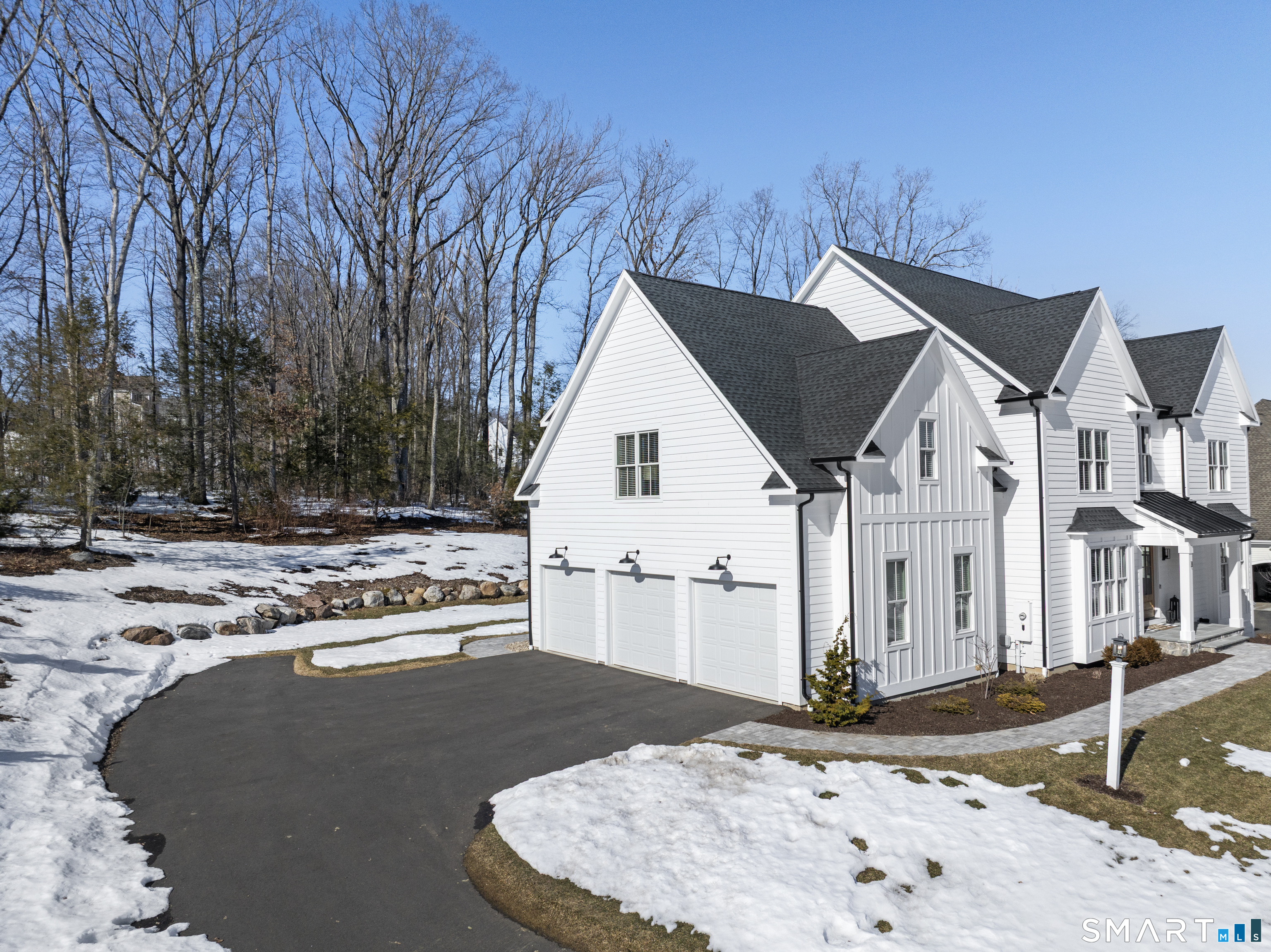 8 Gateshead Way Farmington, CT 06085 - Photo 6 of 39 a view of a white house next to a road and yard