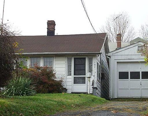 197 Hillcrest Road Bridgeport, CT 06606 - Photo 1 of 1 a front view of a house with a yard