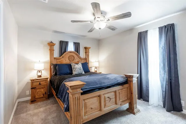 a bed room with a bed and a chandelier