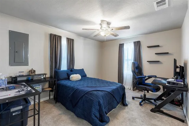 a bedroom with a bed and a table