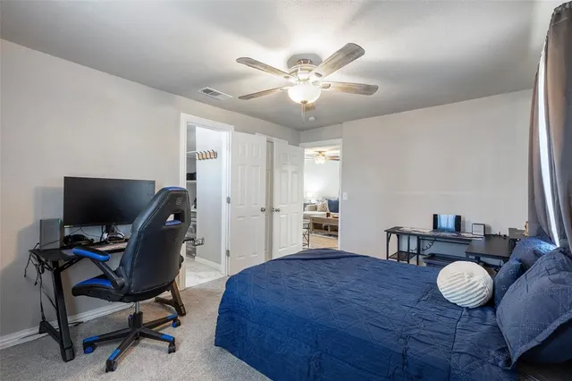 a bedroom with a bed and furniture