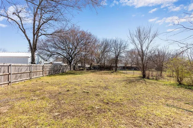 a view of yard covered with snow