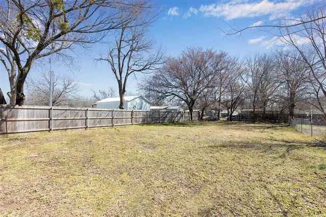 a view of yard with swimming pool