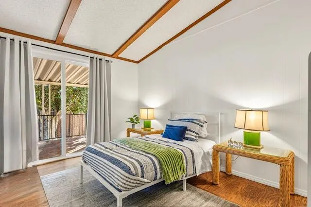 a bedroom with a bed and window