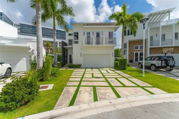 a view of house with swimming pool outdoor seating