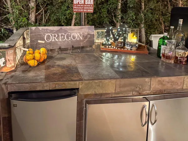 a kitchen with a sink and a stove top oven