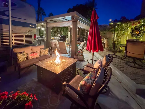 a view of a chairs and table in a patio