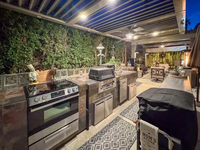 a living room with lots of furniture and a chandelier