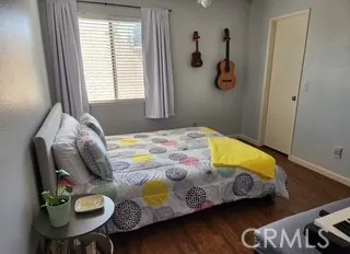 a bedroom with a bed and dresser