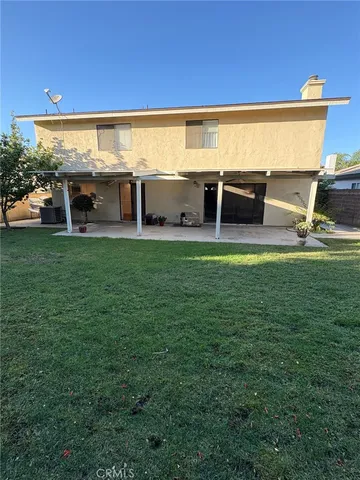 a view of a water fountain and a big yard
