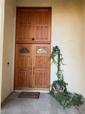 an entryway with wooden floor