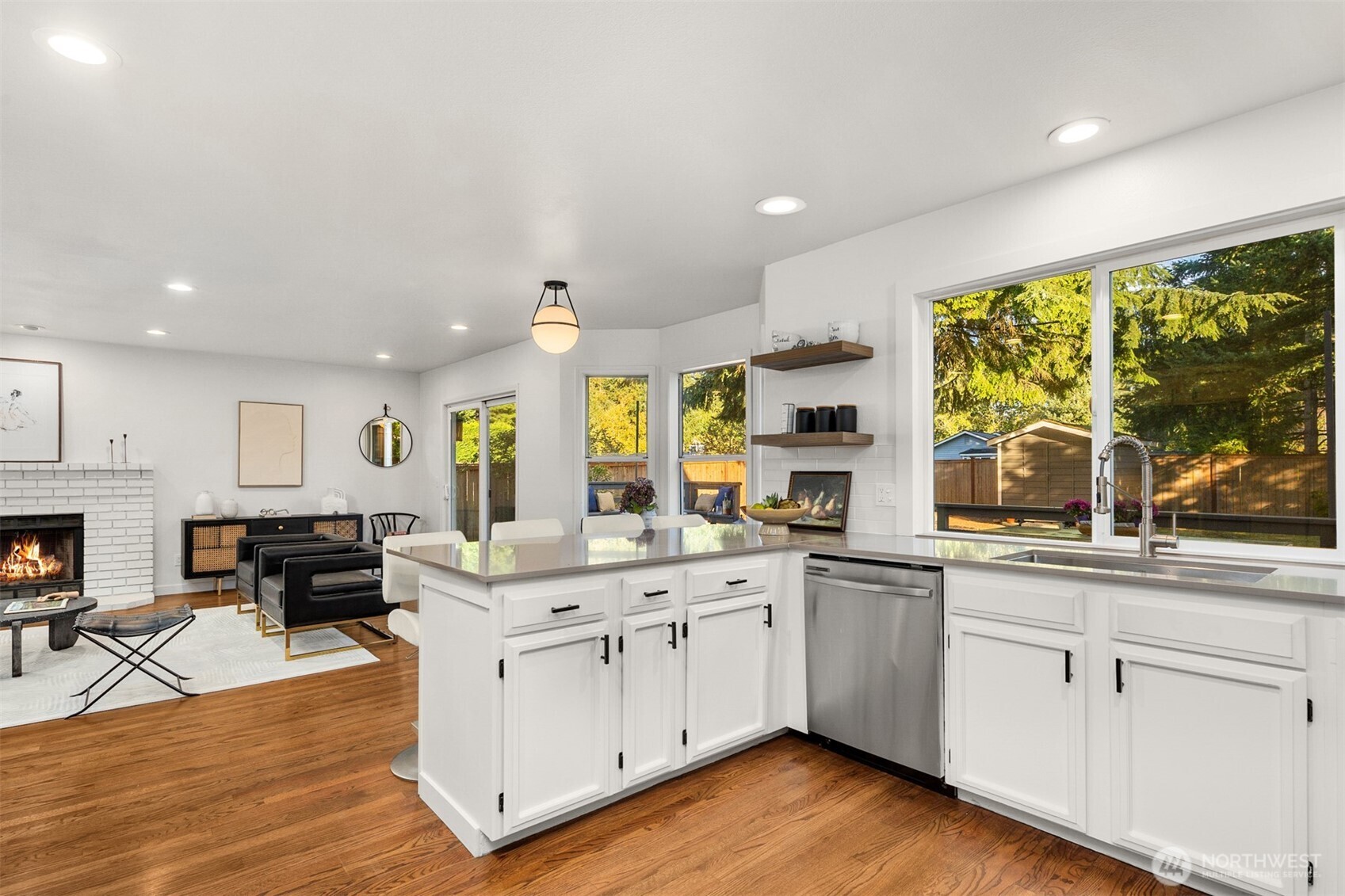 3207 212th Street Southeast Bothell, WA 98021 - Photo 12 of 40 a kitchen with stainless steel appliances granite countertop a stove and cabinets