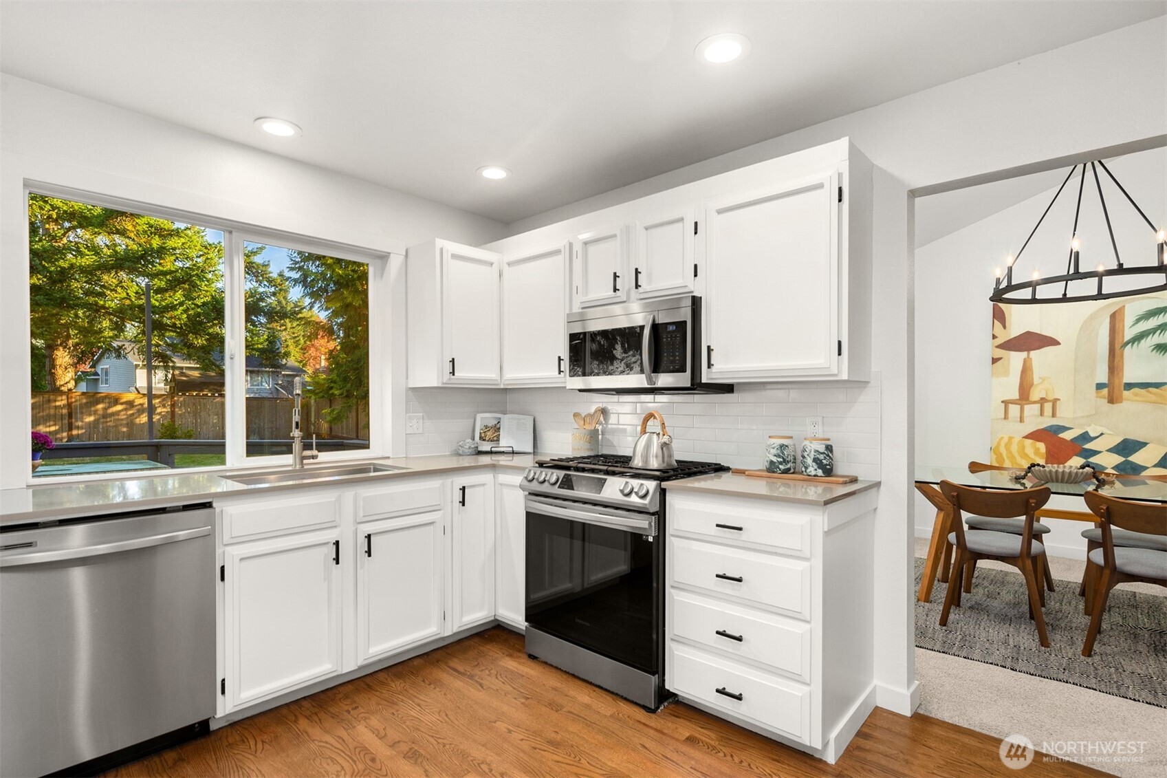 3207 212th Street Southeast Bothell, WA 98021 - Photo 13 of 40 a kitchen with white cabinets and white appliances