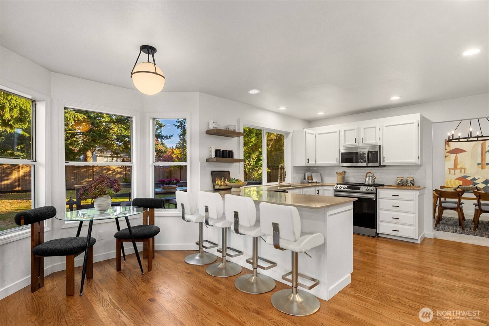 3207 212th Street Southeast Bothell, WA 98021 - Photo 16 of 40 a living room with furniture dining table and a large window