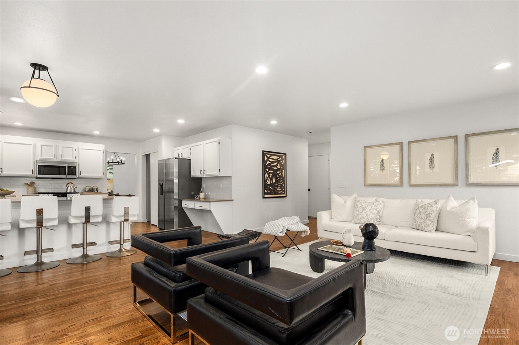 3207 212th Street Southeast Bothell, WA 98021 - Photo 18 of 40 a living room with furniture and a wooden floor