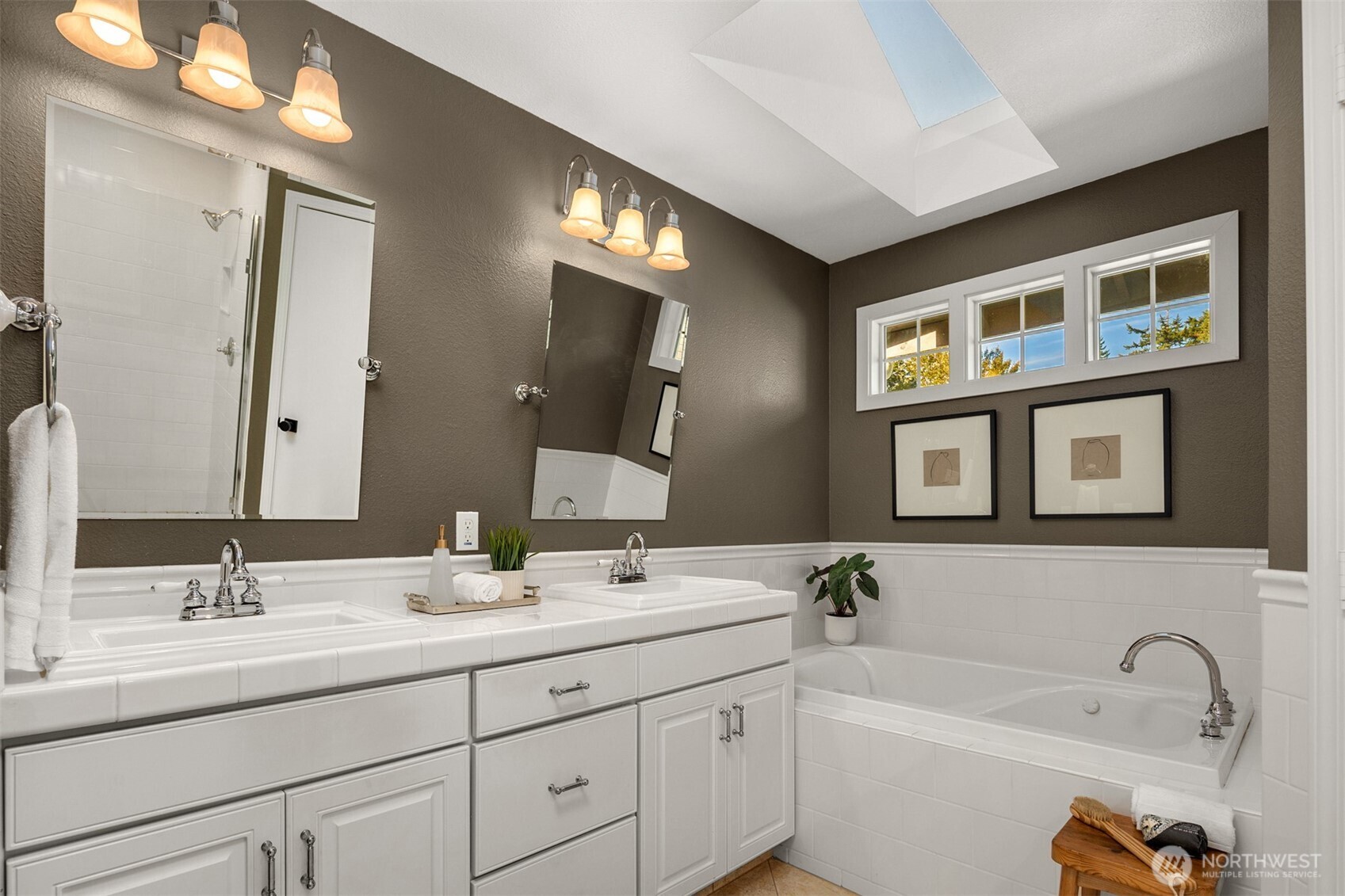 3207 212th Street Southeast Bothell, WA 98021 - Photo 24 of 40 a bathroom with a sink double vanity and a bathtub