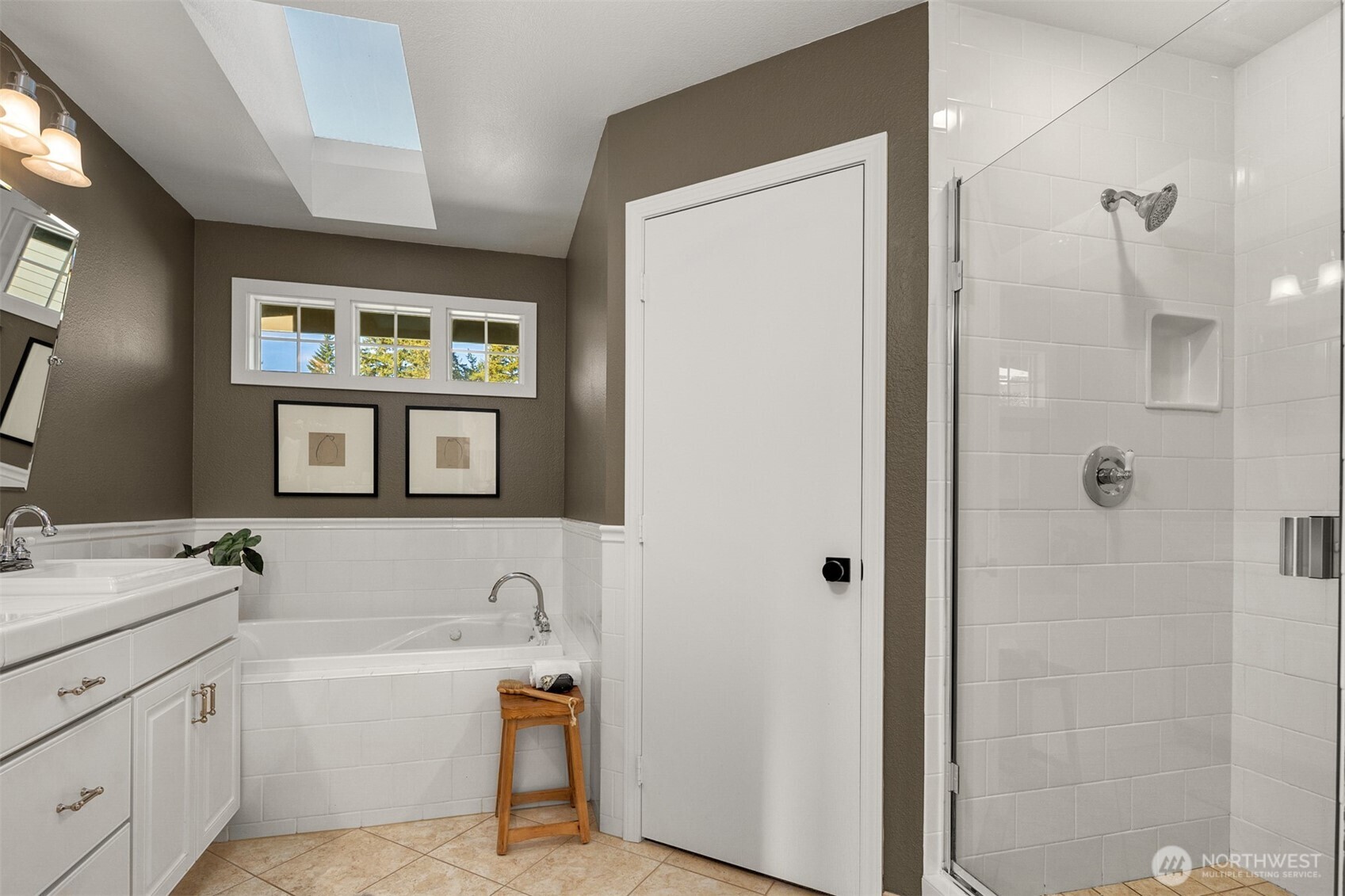 3207 212th Street Southeast Bothell, WA 98021 - Photo 25 of 40 a bathroom with a tub sink and mirror