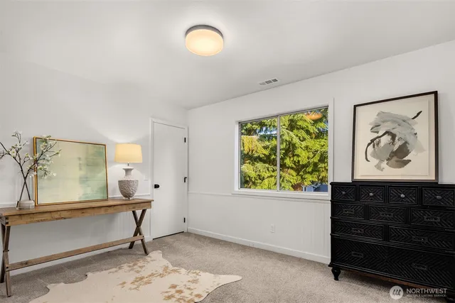 a bedroom with furniture and a window