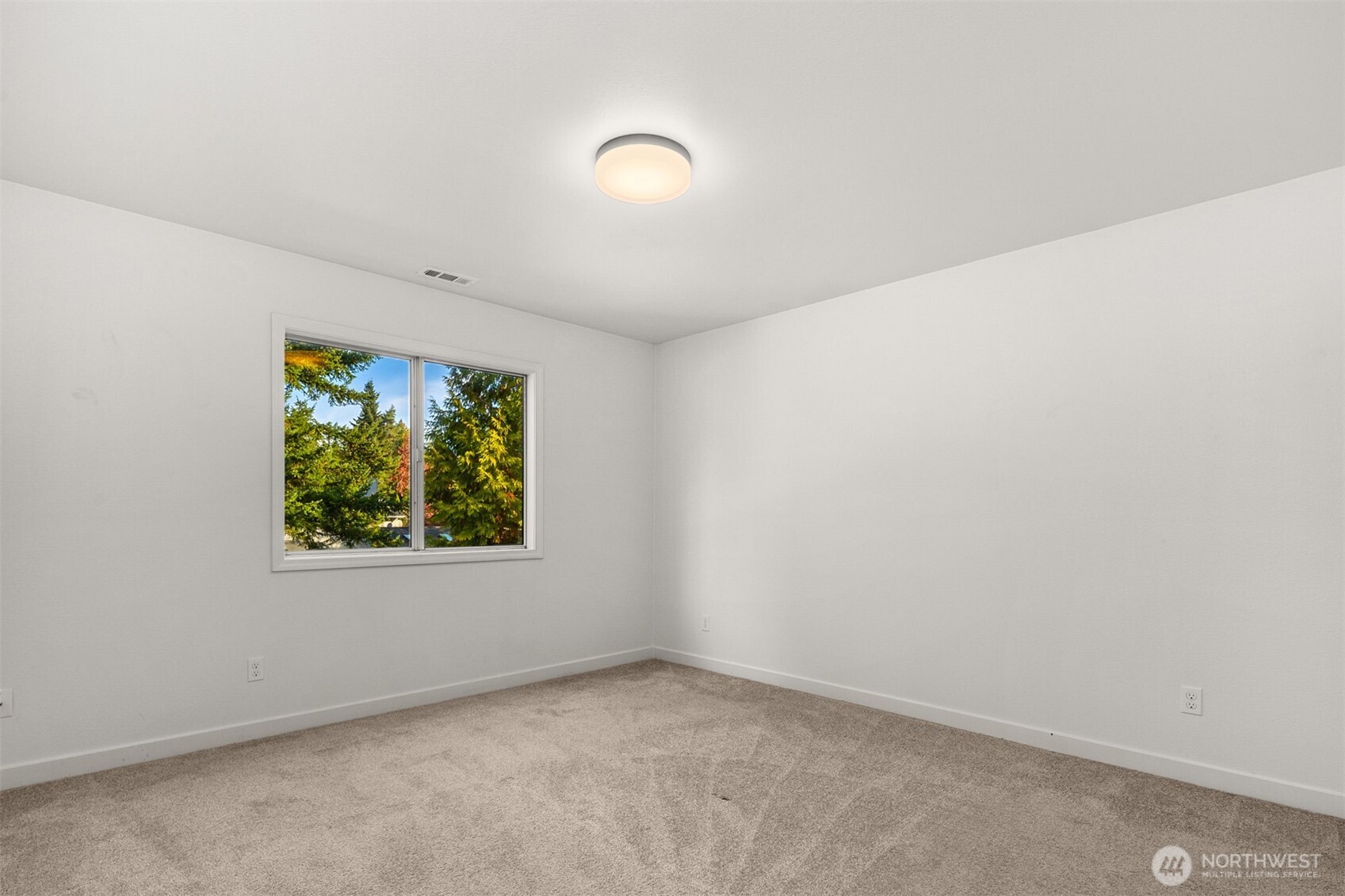 3207 212th Street Southeast Bothell, WA 98021 - Photo 30 of 40 an empty room with windows