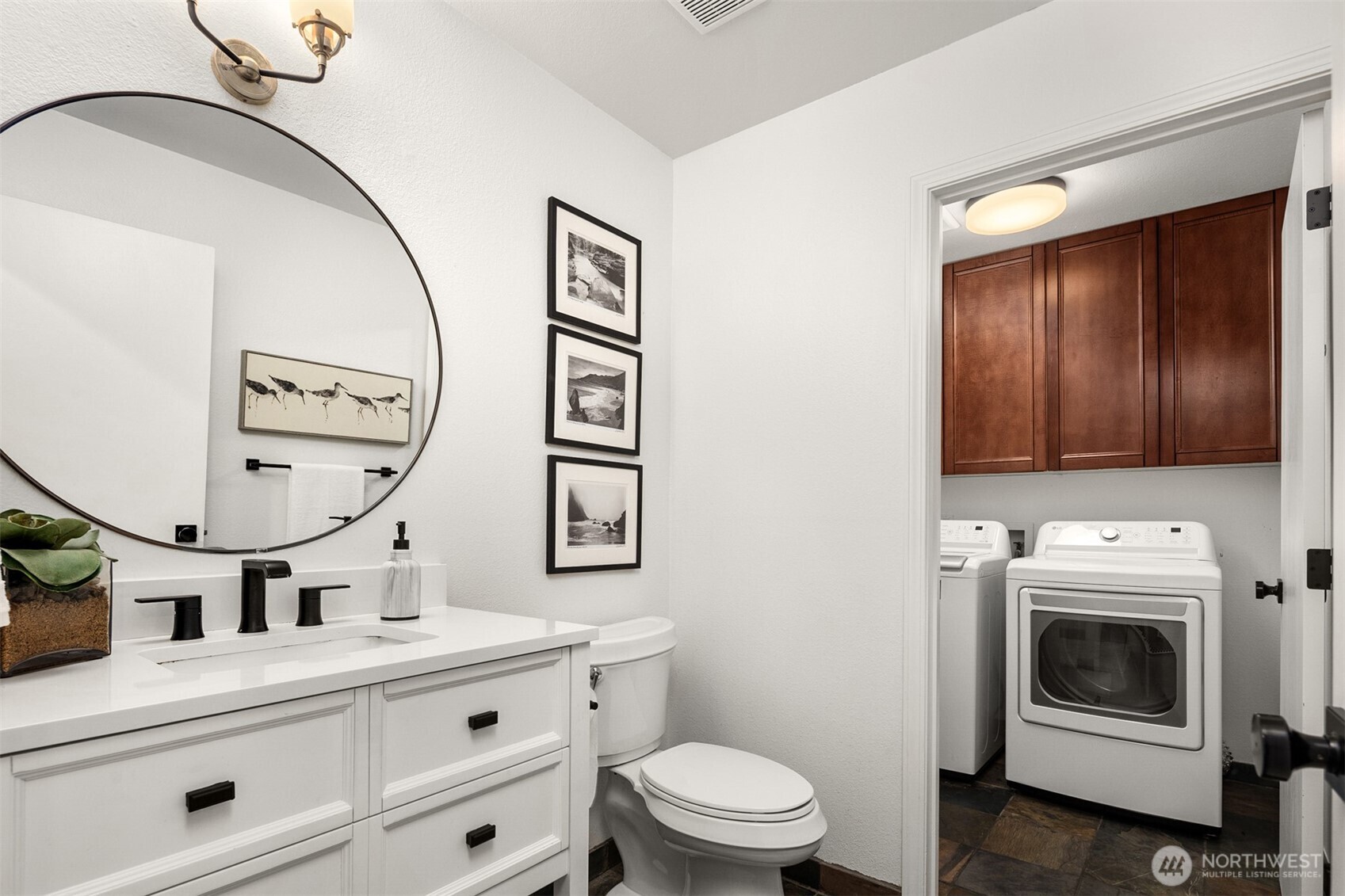 3207 212th Street Southeast Bothell, WA 98021 - Photo 31 of 40 a bathroom with a toilet a sink and mirror