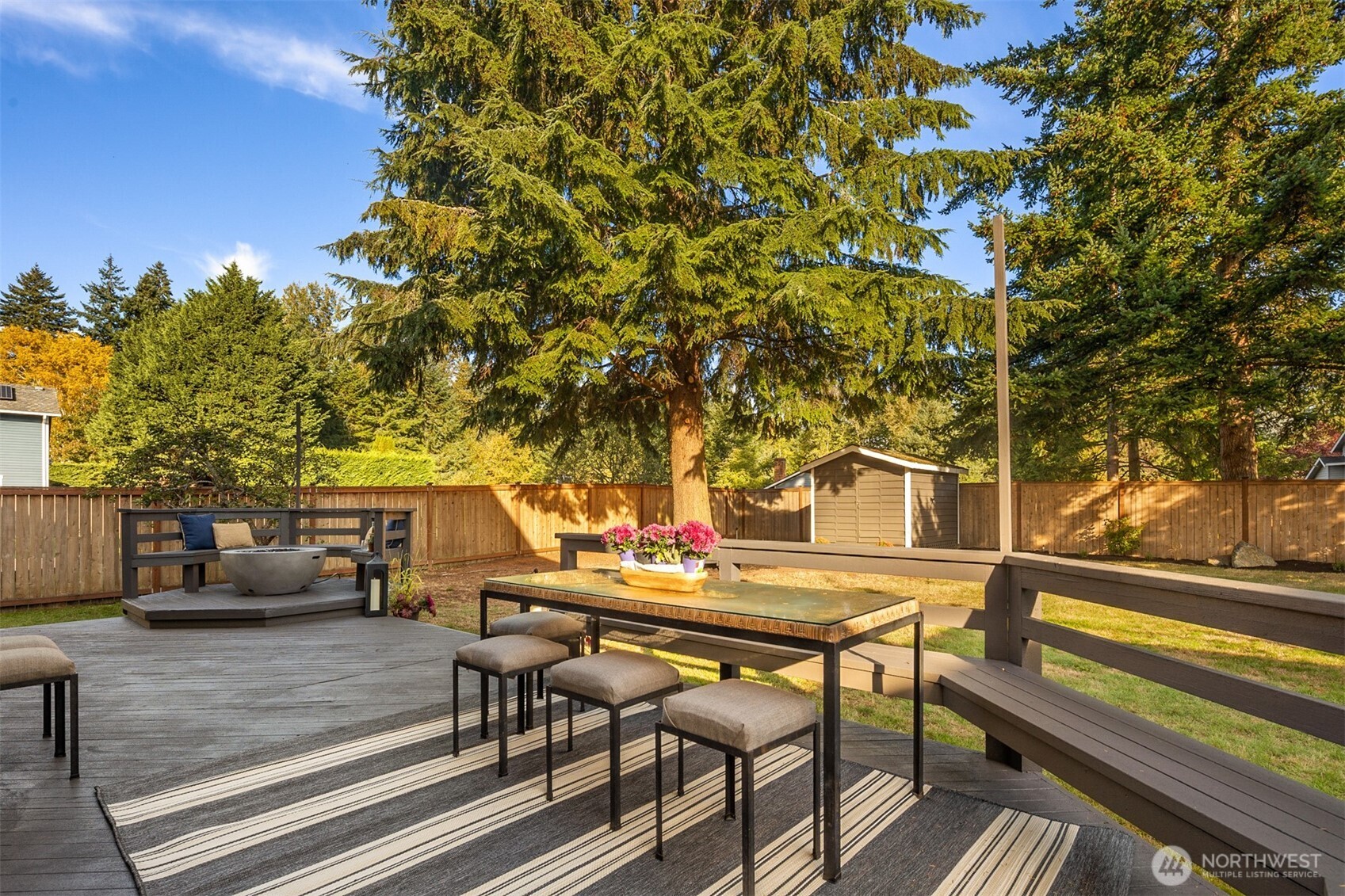 3207 212th Street Southeast Bothell, WA 98021 - Photo 34 of 40 a backyard of a house with table and chairs