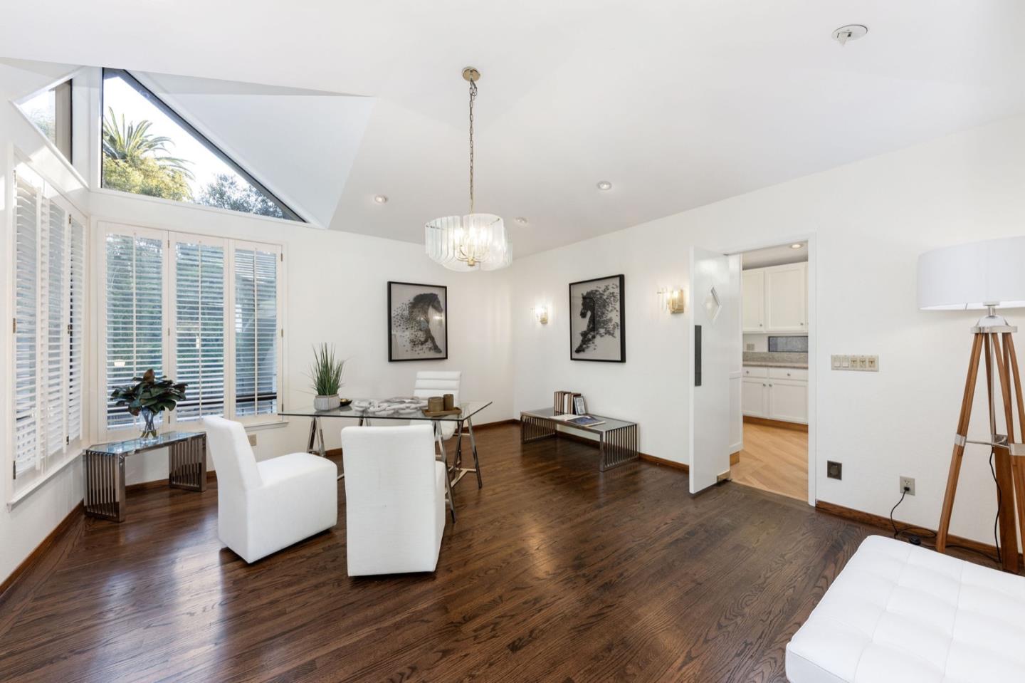 440 Remillard Drive Hillsborough, CA 94010 - Photo 15 of 47 a living room with couches and painting on the wall with wooden floor