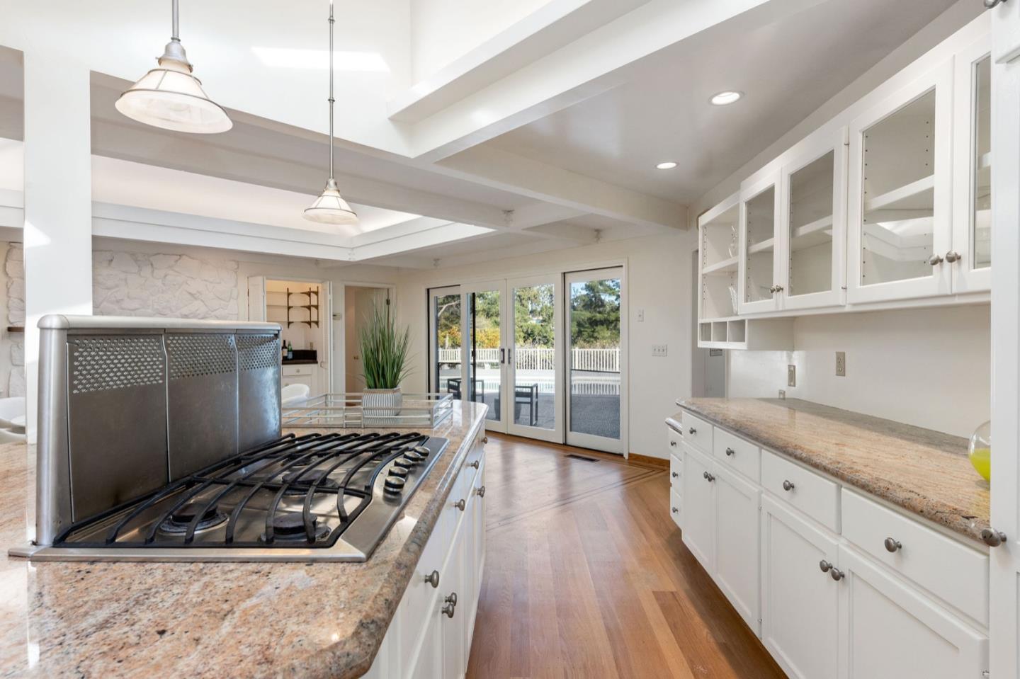 440 Remillard Drive Hillsborough, CA 94010 - Photo 19 of 47 a kitchen with stainless steel appliances granite countertop a stove and a sink