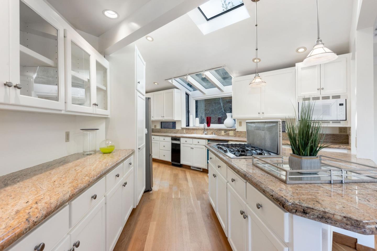 440 Remillard Drive Hillsborough, CA 94010 - Photo 20 of 47 a kitchen with stainless steel appliances granite countertop sink stove and refrigerator