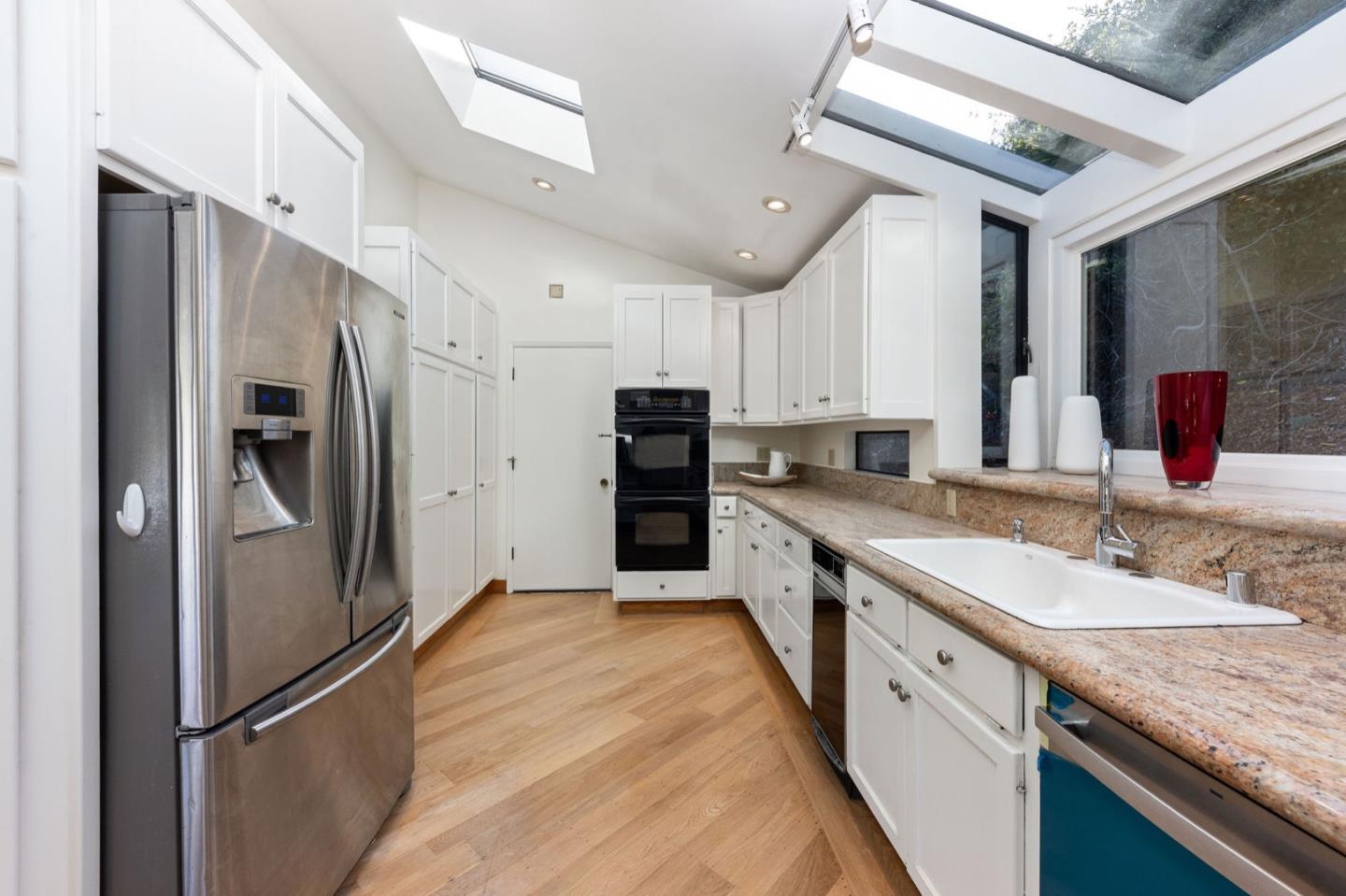 440 Remillard Drive Hillsborough, CA 94010 - Photo 21 of 47 a large kitchen with stainless steel appliances granite countertop a refrigerator and a sink