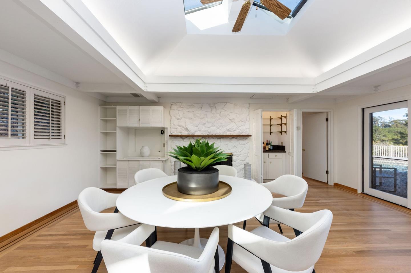 440 Remillard Drive Hillsborough, CA 94010 - Photo 25 of 47 a dining room with furniture and wooden floor