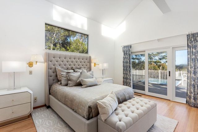 a bedroom with a bed and a couch