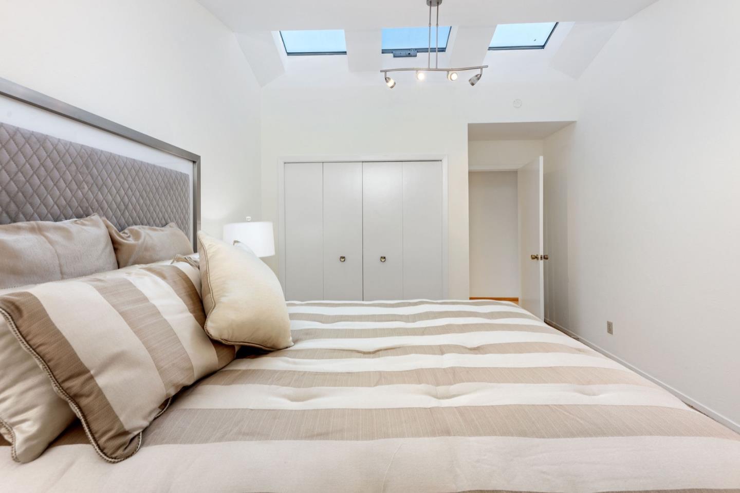 440 Remillard Drive Hillsborough, CA 94010 - Photo 36 of 47 a large white bed in a white room