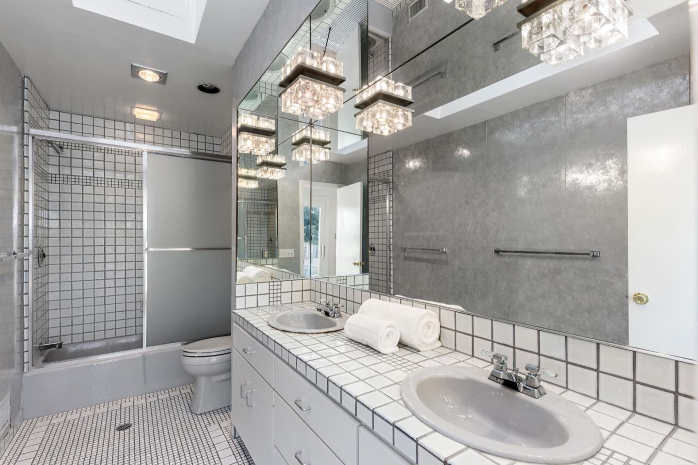 440 Remillard Drive Hillsborough, CA 94010 - Photo 39 of 47 a bathroom with a sink a toilet and shower