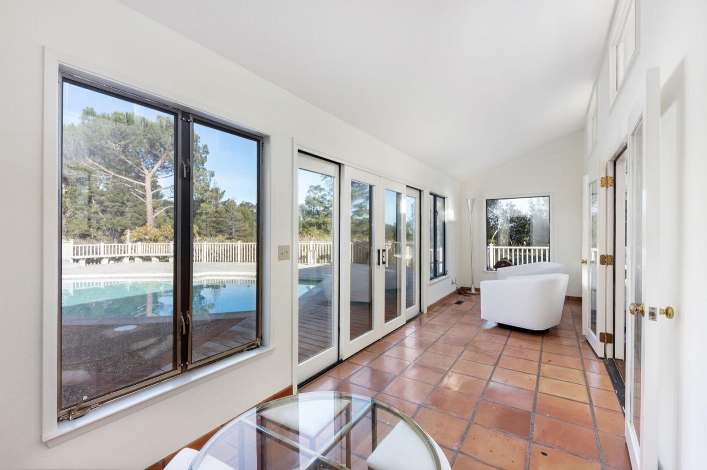 440 Remillard Drive Hillsborough, CA 94010 - Photo 42 of 47 a room with a bed and glass door