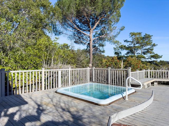 a view of interior space with wooden floor and windows