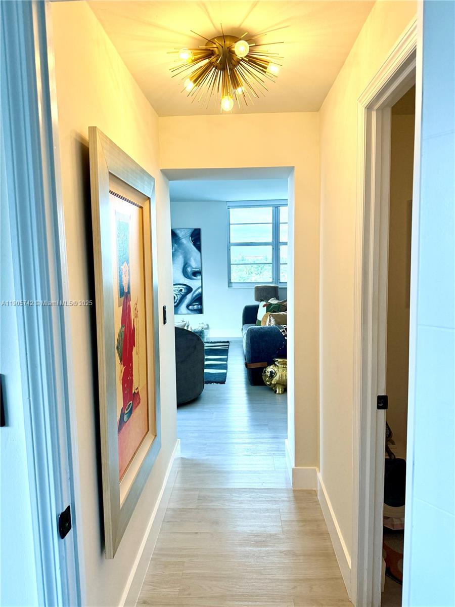 2829 Indian Creek Drive, Unit 603 Miami Beach, FL 33140 - Photo 10 of 28 a view of a hallway and a livingroom with furniture
