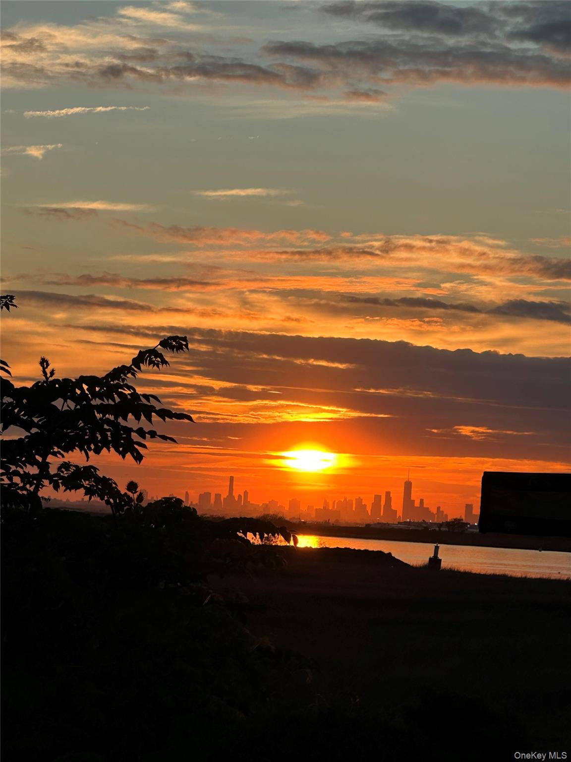 26 Cheshire Road Inwood, NY 11096 - Photo 1 of 22 a view of an ocean and beach