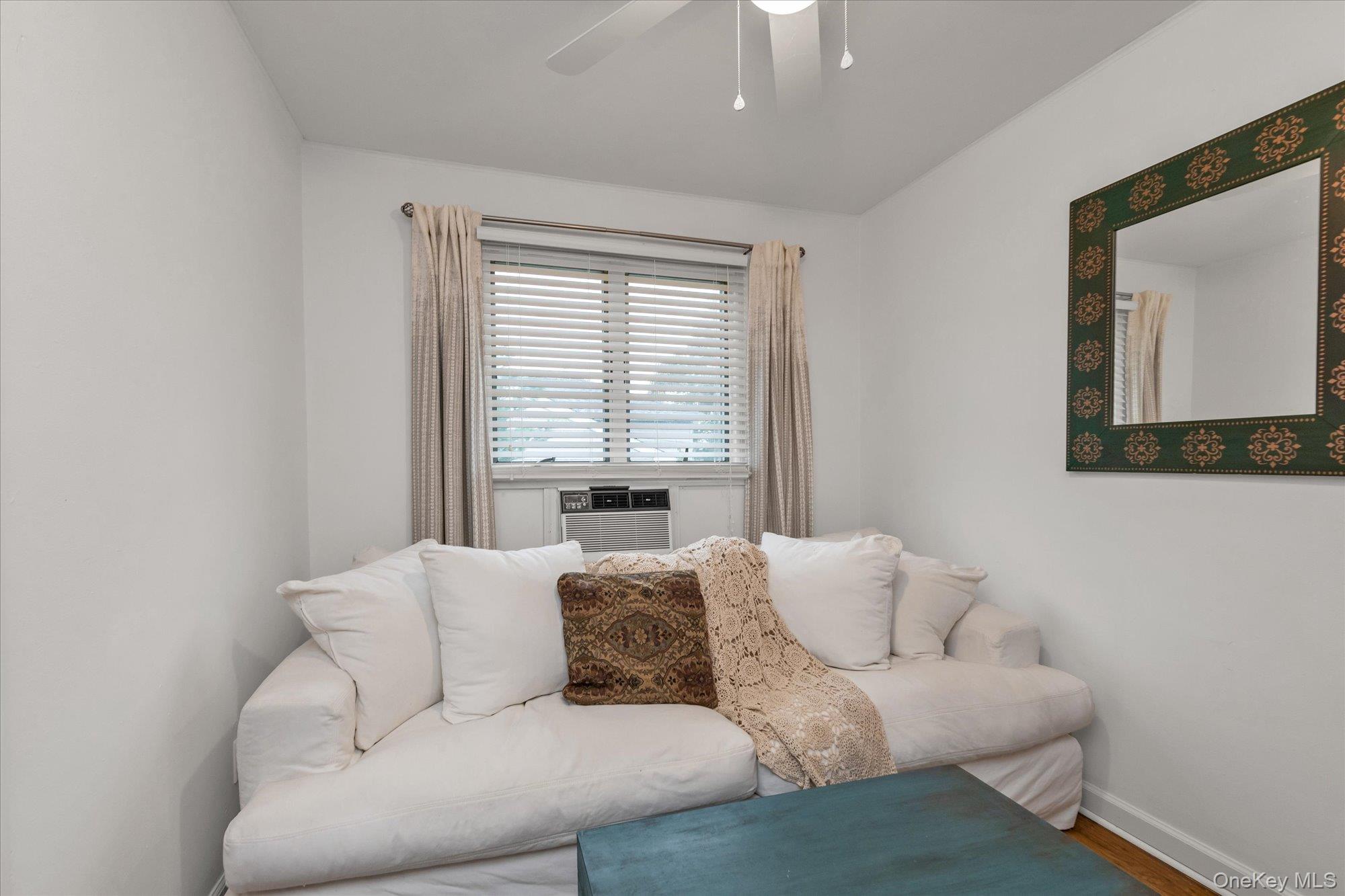 26 Cheshire Road Inwood, NY 11096 - Photo 10 of 22 Bedroom/Den with ceiling fan and wood finished floors
