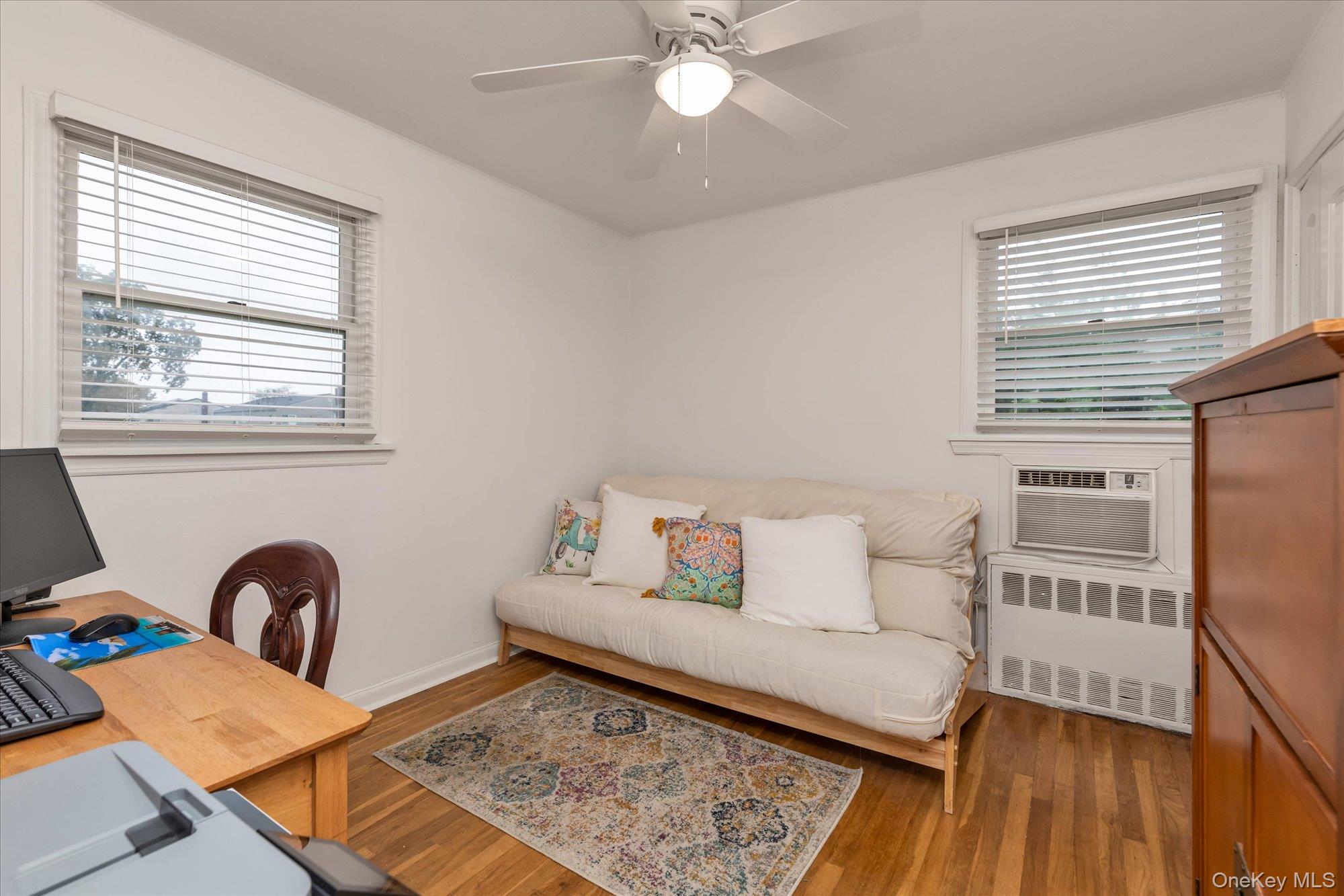 26 Cheshire Road Inwood, NY 11096 - Photo 11 of 22 Bedroom featuring wood finished floors, & a ceiling fan,