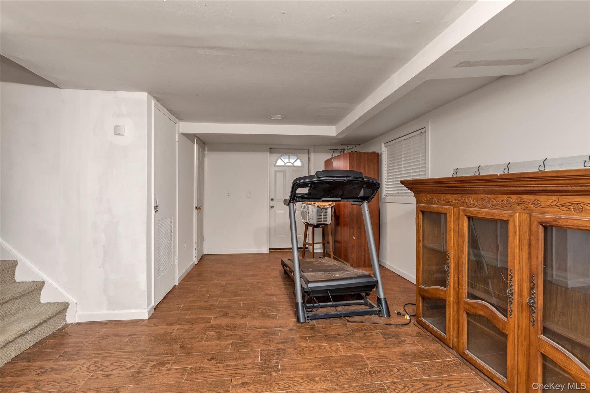 26 Cheshire Road Inwood, NY 11096 - Photo 13 of 22 Family room with wood finished floors