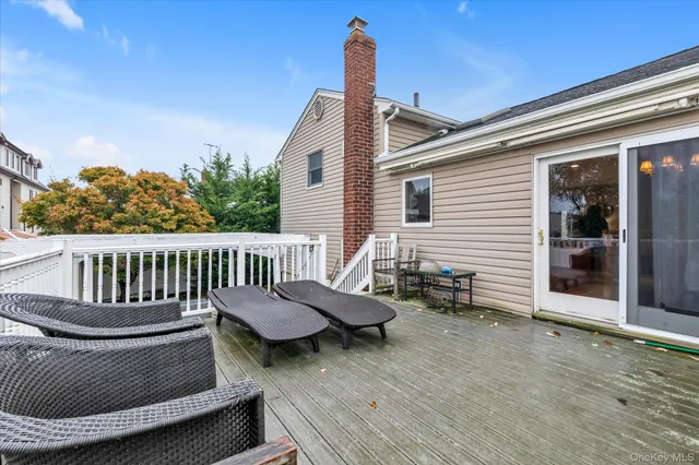 a bathroom with a toilet sink vanity and mirror