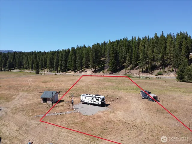 a view of a road with trees and outdoor space