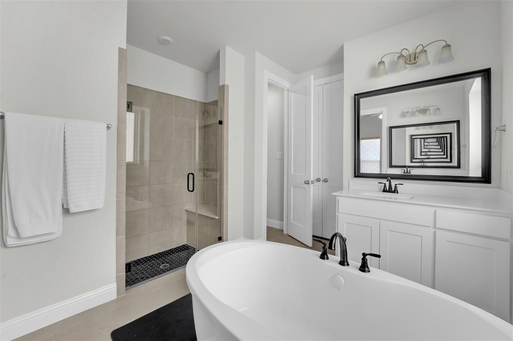 3520 Helios Lane Corinth, TX 76208 - Photo 18 of 37 Freestanding soaking tub with matte black fixtures