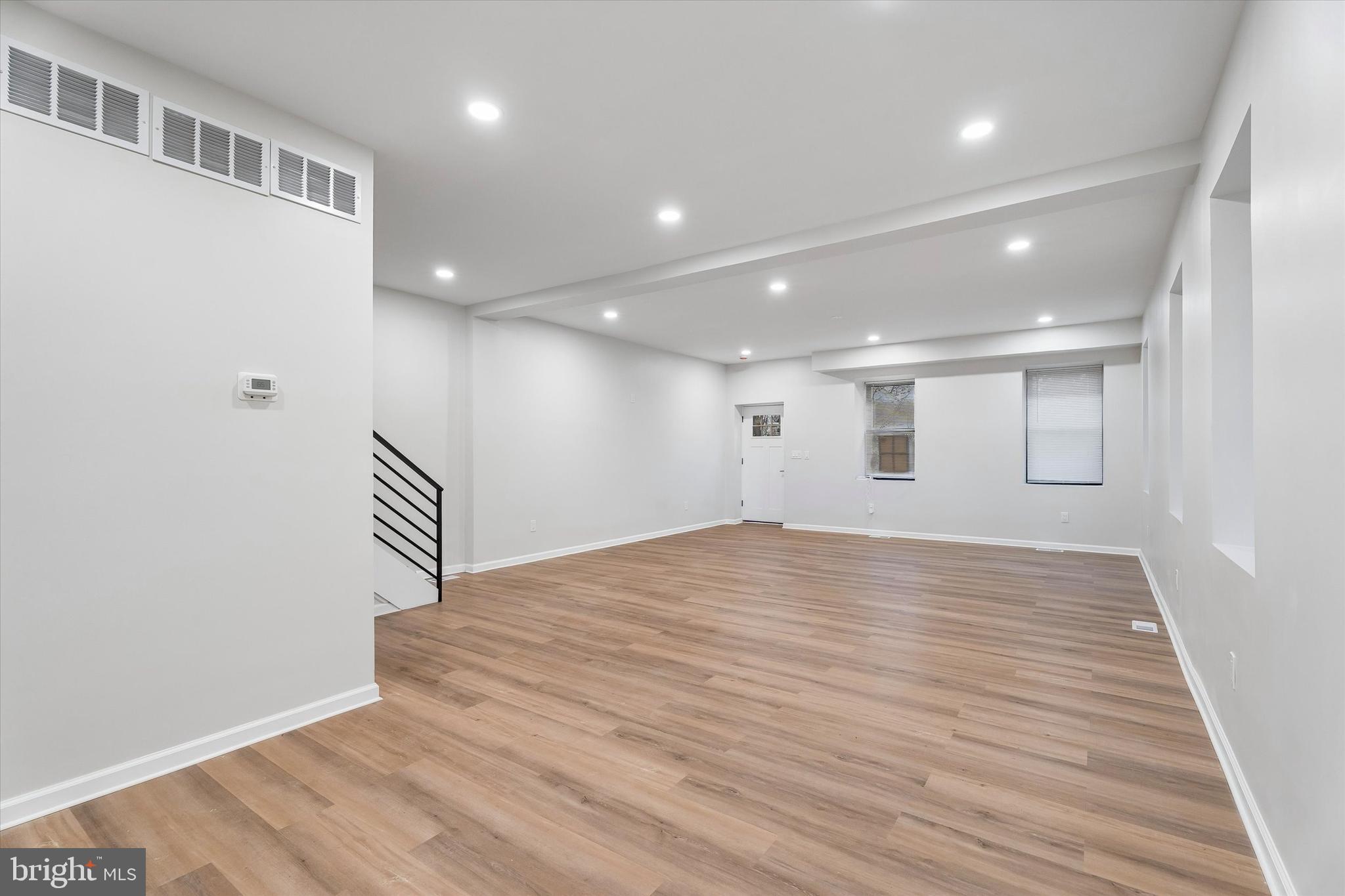 4359 Fleming Street Philadelphia, PA 19128 - Photo 21 of 43 a view of an empty room with wooden floor and a window