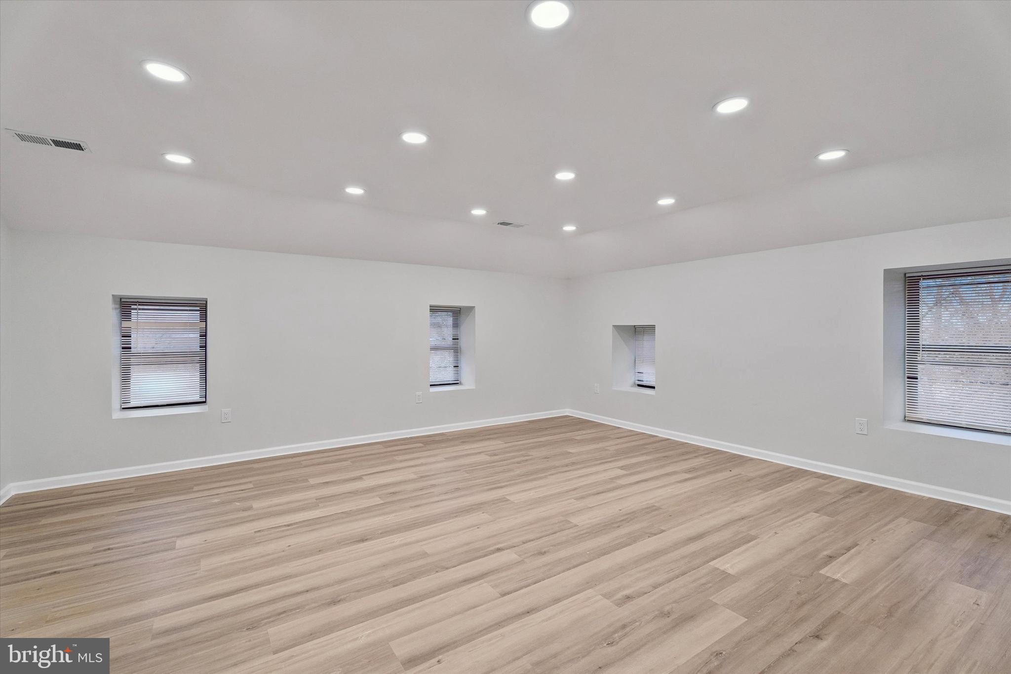 4359 Fleming Street Philadelphia, PA 19128 - Photo 27 of 43 an empty room with wooden floor and windows