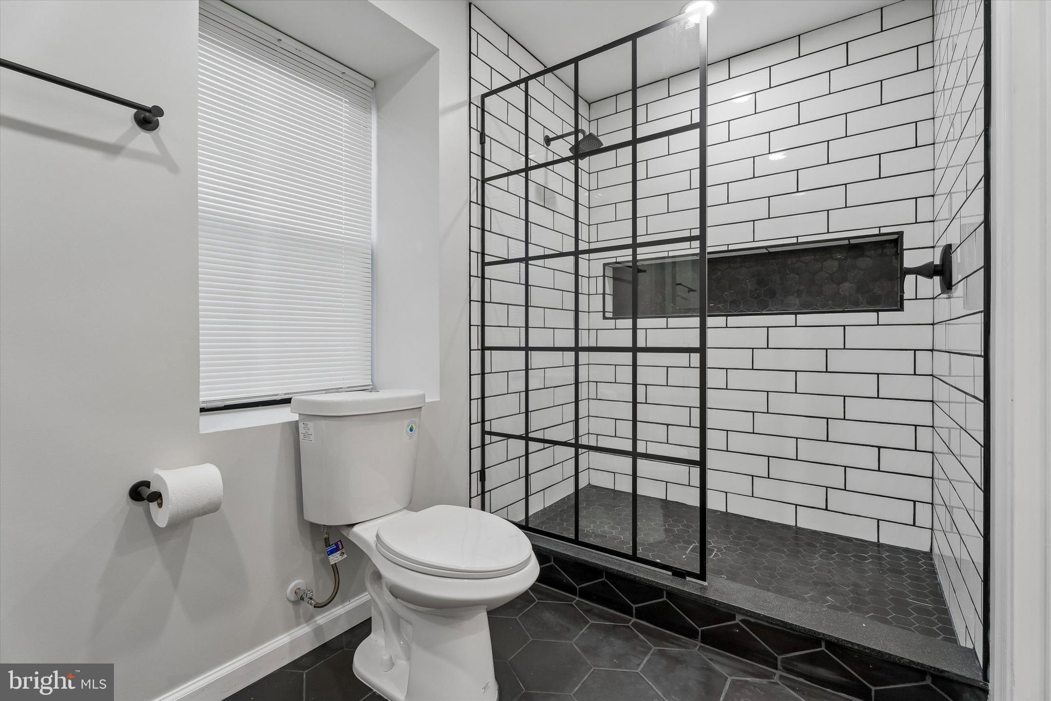 4359 Fleming Street Philadelphia, PA 19128 - Photo 34 of 43 a bathroom with a toilet and a shower