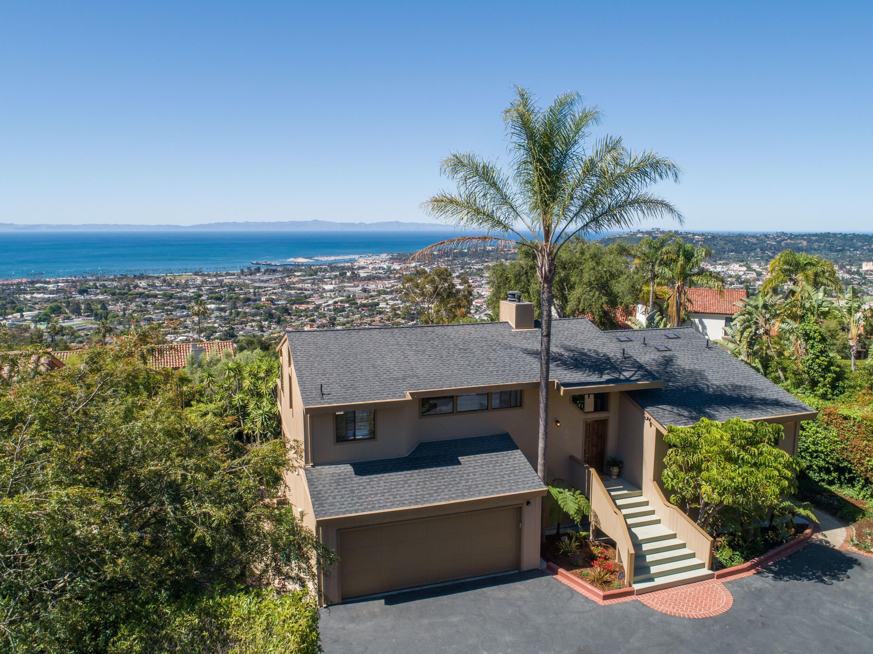 a view of a terrace with a garden and outdoor seating