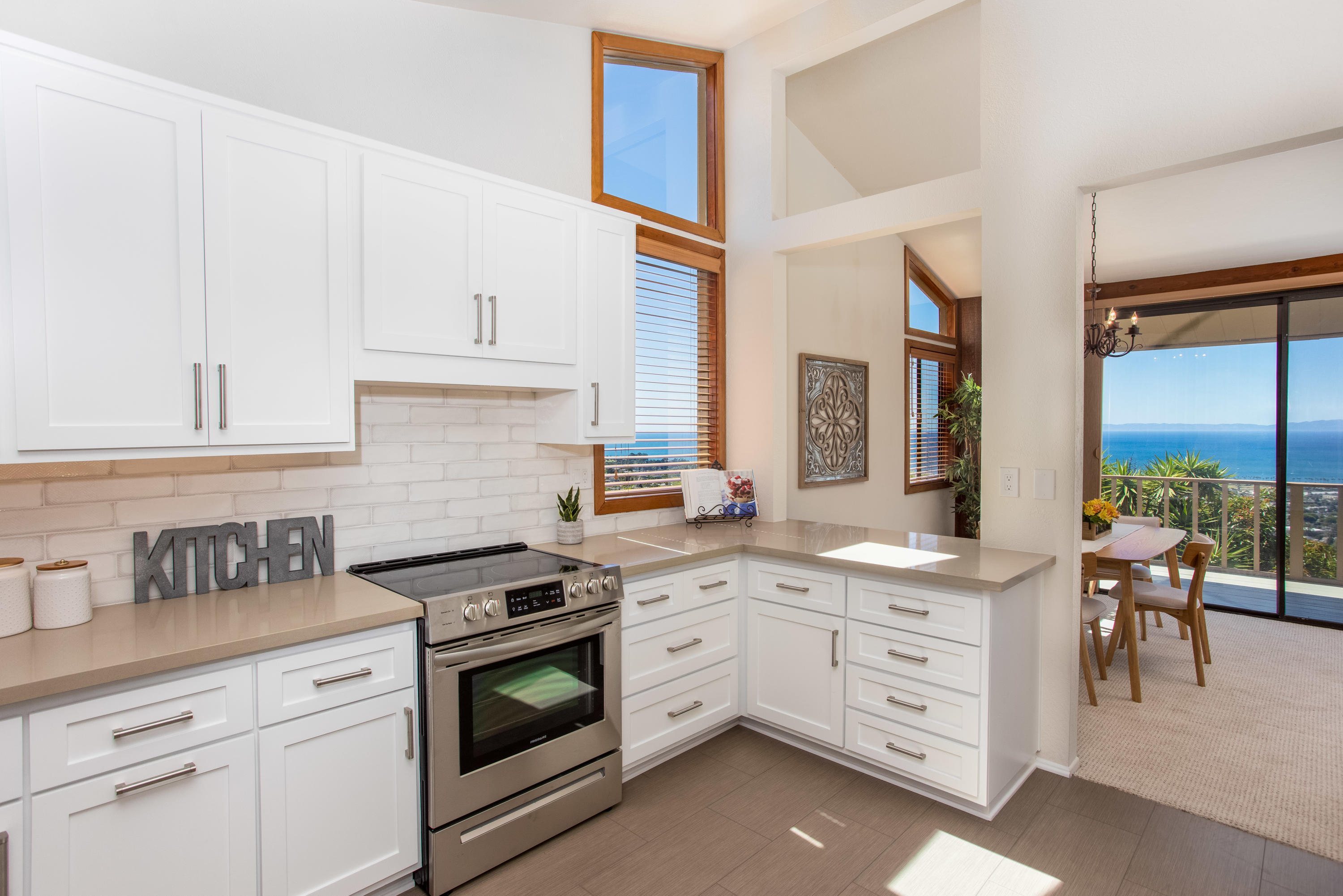 624 Las Alturas Road Santa Barbara, CA 93103 - Photo 11 of 40 a kitchen with granite countertop a sink a stove and cabinets