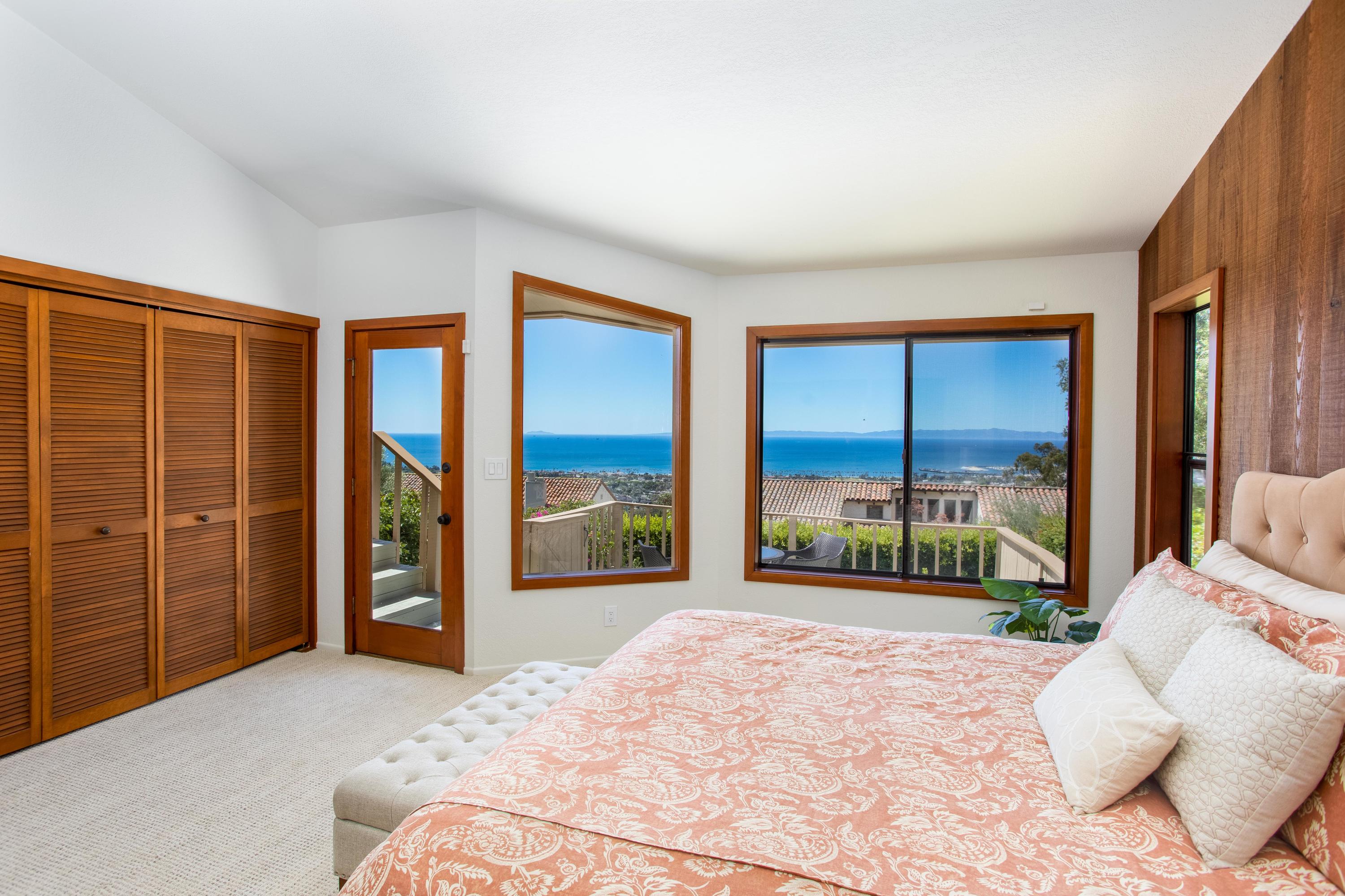 624 Las Alturas Road Santa Barbara, CA 93103 - Photo 16 of 40 a bedroom with a large bed and a large window