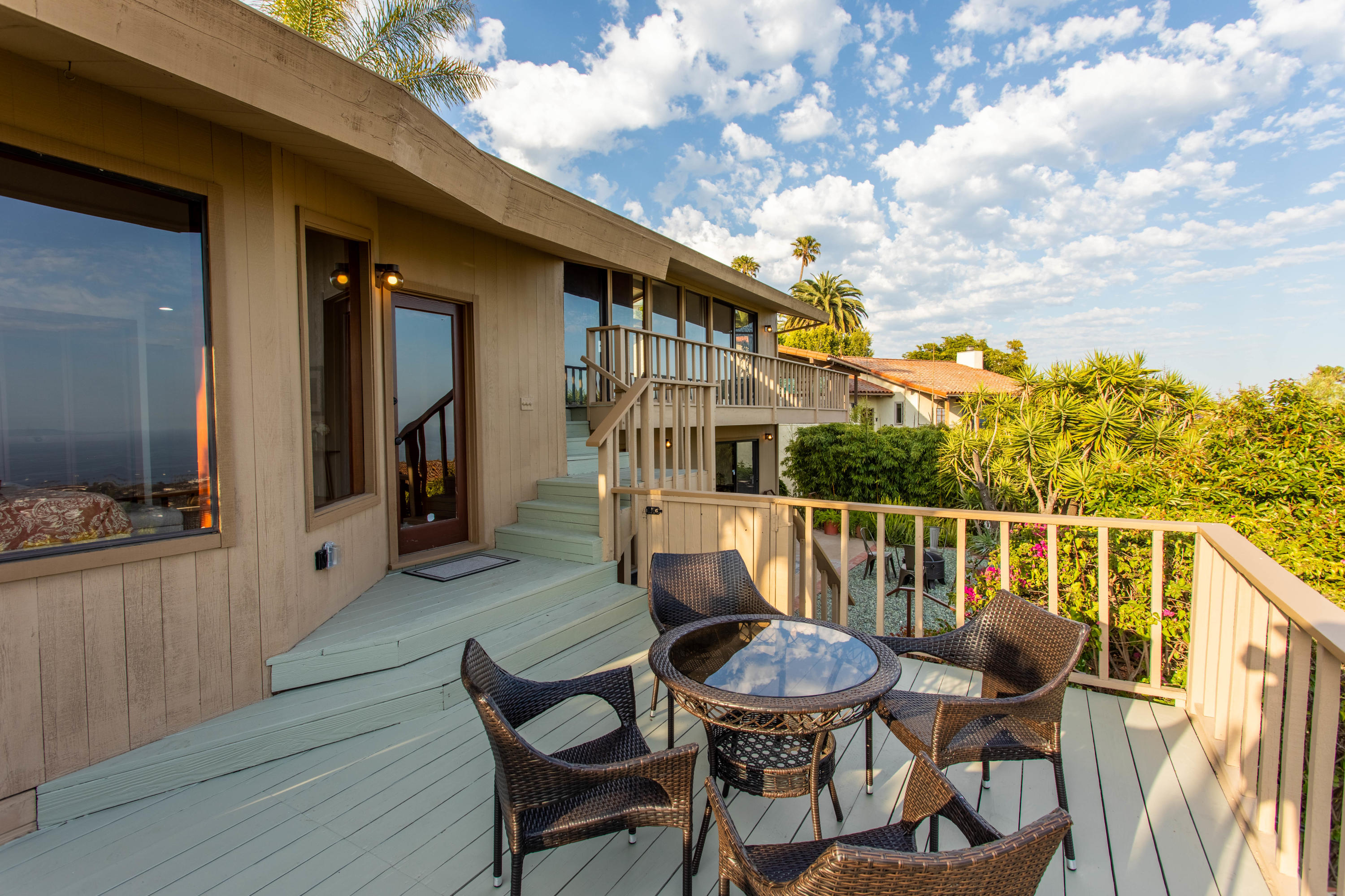 624 Las Alturas Road Santa Barbara, CA 93103 - Photo 19 of 40 a balcony with table and chairs